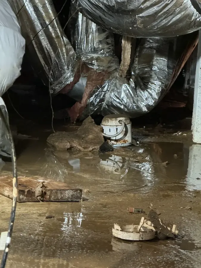 Frozen and split water pipe in a High Point, NC crawl space